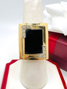 Vintage 14K Yellow Gold Black Onyx & Diamond 0.04ct Ring Size 6.75 A perfect gift for your loved one for any special occasion or holiday! Total Ring Weight: 6.43g Ring Length: 25.58mm Ring Width: 19.81mm Gemstone: Diamond, Star Sapphire Total Diamond: 0.06ct A perfect gift for your loved one for any special occasion or holiday! Total Ring Weight: 6.72g Ring Length: 23.30mm Ring Width: 20.20mm Gemstone: Diamond, Black Onyx Total Diamond: 0.04ct Item will be placed into a gift box. * Elegant Black Diamond Ring As Gift, Formal Black Diamond Ring With Diamond Accents, Classic Black Diamond Ring As A Gift, Classic Black Diamond Ring Gift, Classic Black Diamond Ring For Gift, Luxury Black Diamond Ring For Anniversary, Black Diamond Ring With Vvs Clarity In 14k Gold, Black Diamond Rings For Formal Occasions, Formal Gold Diamond Ring With Black Enamel