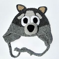 a crocheted hat with an animal's face on the front and side