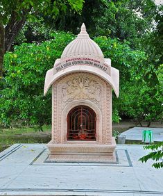 an outdoor fireplace in the middle of a park