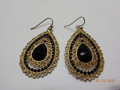 "Vintage gorgeous gold tone teardrop pierced dangles. 1\" x 1 1/2\", gold tone metal, tiny black beads (all are present and intact) & one black faceted teardrop cabochon in the center. This is absolutely classic & in excellent condition." Black Teardrop Chandelier Earrings With Dangling Beads, Black Beaded Teardrop Earrings, Teardrop Gold Beads Earrings For Party, Gold Beaded Earrings With Black Beads For Party, Gold Beaded Costume Jewelry Earrings, Gold Beaded Teardrop Earrings In Metal, Teardrop Gold Beads Jewelry For Party, Gold Dangle Earrings With Black Beads, Gold Beaded Teardrop Chandelier Earrings