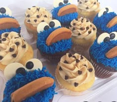 cupcakes decorated with frosting and decorations in the shape of cookie monster faces