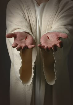 a person with their hands in the shape of a hand that has been torn open