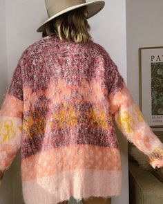 The colors, pattern, weight and feel of this colorful oversized cardigan gives you the warm and fuzzy feelings inside (literally!). Fit: Oversized. Model Wearing a Small (Height 5'4", Weight 125lbs, (Wears XS or Small or 25) Material: 70% Polyester, 30% Acrylic Care Instructions: Delicate/ Hand Wash Cold, Tumble Dry, Iron Low Trendy Oversized Pink Sweater Coat, Oversized Cozy Warm Cardigan, Cozy Oversized Warm Cardigan, Multicolor Acrylic Outerwear For Layering, Oversized Cozy Acrylic Cardigan, Winter Multicolor Cardigan For Layering, Cozy Oversized Acrylic Cardigan, Multicolor Winter Cardigan For Layering, One Size Multicolor Soft Knit Cardigan