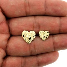 "Product Description: Brand New 10K Solid Yellow Gold Diamond Cut Heart Nugget Stud Earrings - 2 Sizes Approximate Weight - Height - Width Small - Weight: 1.7 Grams - Length: 0.45\"(11mm) Width: 0.45(11mm) Medium - Weight: 2.1 Grams - Length: 0.60\"(15mm) Width: 0.60(15mm) Metal: Real, Genuine 10K Yellow Gold ( Not Plated) Metal Purity: Stamped 10K Design: Diamond-Cut Heart Nugget Stud Earrings Material: 10K Genuine Gold Metal Stamp: 10K Country of Manufacture: Italy It comes in a Beautiful Free Gift Box These Earrings are 100% Authentic 10K Gold \"Not Plated or Filled\" This is a Beautiful Genuine 10K Solid Yellow Gold Nugget Stud Earrings will look Great on Men & Women. SHIPPING & RETURN POLICY FREE SHIPPING IN THE USA We Offer 30 Days Refund & Exchange Policy To view our entire collecti Gold Nugget, Solid Yellow, 10k Gold, Metal Stamping, Diamond Cut, Jewelry Earrings Studs, Medium Weight, Sterling Silver Jewelry, Gold Diamond