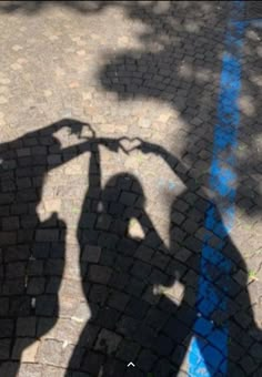 the shadow of a person holding an umbrella