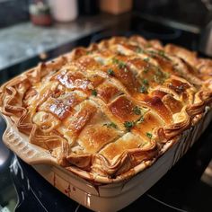 a large pie sitting on top of a stove