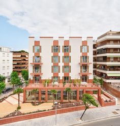 an apartment building in the middle of a city