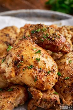 closeup of chicken wings with herbs on the side