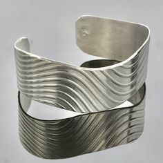 Fine Silver Wave Cuff Bracelet Medium Width Modern Handmade Cuff Bracelets, Modern Handmade Bangle As A Gift, Handmade Modern Bangle As Gift, Modern Handmade Cuff Jewelry, Artistic Adjustable Cuff Jewelry, Adjustable Artistic Cuff Jewelry, Artistic Silver Bangle Bracelet, Artistic Silver Bangle Bracelets, Adjustable Artistic Sterling Silver Bracelets