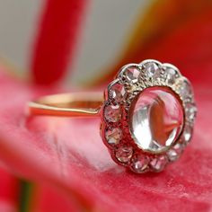 I'm selling a few pieces of my personal collection as they aren't getting enough wear and I want someone else to enjoy them. This is a lovely Victorian era piece, an 8mm rock crystal cabochon surrounded by a halo of rose cut diamonds, set in 18k yellow gold topped with platinum. Ring face measures 13mm in diameter, ring size 5. Sizing available Layaway available Vintage Diamond Crystal Ring With Gemstone, Vintage Diamond Halo Jewelry, Vintage Diamond White Gemstone Ring, Vintage Halo Ring Jewelry, Vintage Round Cut Jewelry With Halo Design, Vintage Halo Design Ring, Vintage Gemstone Halo Ring For Anniversary, Vintage Halo Design Jewelry For Gifts, Vintage Silver Diamond Ring With Halo Design