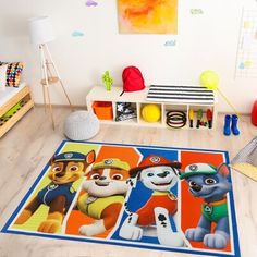 children's playroom with toys and rugs featuring paw patrol characters on the floor