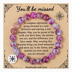 a handmade bracelet with a poem written in the center and purple beads on it