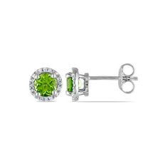 These exquisite stud earrings each feature a round cut peridot stone surrounded by a halo of 12 round white diamonds. This classic pair is set in sterling silver and are secured with butterfly backs. Green peridot is the featured birthstone for the month of August. 1.12 Carat (ctw) Peridot Halo Earrings in Sterling Silver with Diamonds Size: one size.  Gender: female.  Age Group: adult. Green Diamond Accented Round Earrings, Green Round Earrings With Halo Setting, Green Round Earrings With Diamond Accents, Round Peridot Jewelry With Halo Setting, Month Of August, Halo Earrings, Peridot Stone, August 1, Green Peridot