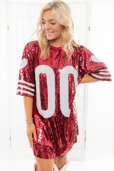 Calling all tailgate queens! We hope you have your party pact because you're going to want to have fun in our Garnet Sequin Jersey Dress! This stunning sequin dress is the perfect addition to your tailgate wardrobe! Featuring garnet sequins, short sleeves, and a mini hem, in this dress you're ready to party!Features: Garnet SequinsJersey graphicLined Boxy FitOne Size fits most Bust: 48in Length: 33in Sequin Jersey Dress, Sequin Jersey, Gameday Dress, Jersey Dress, Sequin Dress, Have Fun, Garnet, Sequin, Short Sleeves