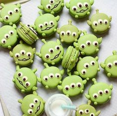 there are many green cookies with eyes on them