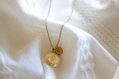 This locket necklace features a charming flower design and a flat circular shape. It serves as a keepsake for your most treasured memories, allowing you to insert a photo within it. Talk about a perfect gift idea! * How To Order 1. Choose the size. 2. Select initials, if you do not want any initial, select "NONE" (UPPER CASE and HEART Shape Available) if you want LOWERCASE please message me BEFORE placing the order!) 3. Add to cart and submit order :) * Locket : Photo Frame Pendant, Flat Round w Silver Medallion Necklace For Anniversary, Initial Pendant Necklace With Vintage Charm As Gift, Vintage Charm Initial Pendant Necklace Gift, Vintage Initial Pendant Necklace For Gifts, Elegant Medallion Necklace With Initial Pendant As A Gift, Elegant Charms Locket Necklace For Mother's Day, Vintage Charm Medallion Necklace For Gift, Elegant Round Pendant Locket Necklace For Mother's Day, Elegant Medallion Locket Necklace For Mother's Day