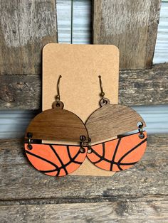 What a fun accessory to have for game days!  These adorable basketball split earring dangles are a walnut wood on top, and painted orange and black on the bottom to resemble a basketball. Clay Basketball Earrings, Basketball Earrings Svg, Painted Basketball, Sports Team Earrings, Earrings Basketball, Laser Earrings, Basketball Earrings, Sports Earrings, Engraving Ideas