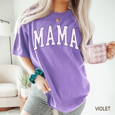 Comfort Colors® Retro Mama Shirt, Gift For New Mom Gift, Cute Violet Mama T-Shirt, Comfort Colors® Oversized Tee, Mothers Day Gift For Mom, Varsity Tshirt  SIZING  ❥ Modern unisex fit. Runs true to size. ❥ Please refer to size chart before ordering. If possible, measure your favorite t-shirt armpit to armpit and top to bottom and compare it with the size chart provided to ensure an accurate fit. ❥ Sleeves are rolled up in some product pictures, they will not come rolled up on delivery.  DELIVERY Oversized Purple T-shirt With Letter Print, Oversized Purple Top With Text Print, Purple Letter Print Tops For College, Purple Letter Print Top For College, Loose Purple Tops For Everyday, Oversized Purple Top For Everyday, Purple Crew Neck Top With Name Print, Mother's Day Letter Print T-shirt, Everyday Short Sleeve Tops With Lettering