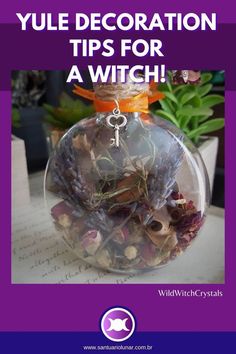 a glass jar filled with lots of different types of items and text that reads, yule decoration tips for a witch