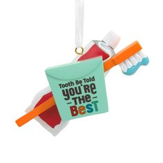 Make your dentist or other oral care provider smile with this cute Christmas tree ornament. The colorful design featuring a toothbrush, tube of toothpaste and dental floss container that reads "Tooth be told you're the best" makes a great addition to a holiday display at home or in the office. | Message: Tooth be told youre the best. | Additional Details: Resin ornament features hanger attachment. | Includes: One Hallmark Christmas tree ornament. | Size Approx.: 3.38 x 2.25 x 1.38 Dental Themed Christmas Tree, Dental Christmas Decor, Dental Ornaments Diy, Dental Christmas Ornament, Dentist Ornaments, Christmas Tree Hallmark Ornaments, Hallmark Christmas Ornaments, Cute Christmas Tree, You're The Best