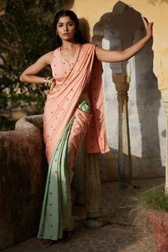 Peach, mint green pre-draped saree with bandhej print. Comes with blouse.
Component: 2
Pattern: Print
Type Of Work: Bandhej Print
Neckline: V neck
Sleeve Type: Sleeveless
Fabric: Modal
Color: Peach
Other Details: 
Pocket on the side
Occasion: Destination Wedding - Aza Fashions Saree With Pocket, Pre Draped Saree, Bandhej Print, Stitched Saree, Draped Saree, Peach Saree, Saree Poses, Fancy Sarees Party Wear, Indian Fashion Saree