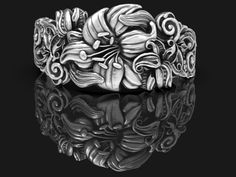 Hey there, flower child! If you're looking for a wedding ring that's as unique and beautiful as you are, check out this Wild Flower Wedding Ring! Featuring a stunning Art Nouveau design of wildflowers, this ring is the perfect choice for anyone who loves nature-inspired jewelry. The intricate detailing on this ring is truly breathtaking and will catch the eye of everyone around you. Made from high-quality sterling silver, this ring is both durable and beautiful. It's the perfect choice for anyon Fleurs Art Nouveau, Flower Wedding Ring, Motifs Art Nouveau, Design Art Nouveau, Romantic Rings, Sterling Silver Promise Rings, Flower Band, Sterling Silver Wedding Rings, Wedding Band