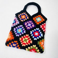 Vintage Crochet Granny Square small tote bag with lining and interior pocket. Measures:  12 inches wide 13 inches from bottom to opening 8 inches from opening to top of handle Condition: Gently used Minor pilling/fuzz on handles (as pictured) Some frayed threads inside (as pictured) Rectangular Bags With Rolled Handles For Daily Use, Rectangular Daily Bags With Rolled Handles, Square Shopping Bags With Rolled Handles, Shopping Crochet Tote Bag With Detachable Handle, Shopping Tote Crochet Bag With Detachable Handle, Rectangular Multicolor Hobo Bag For Errands, Square Bags With Rolled Handles For Daily Use, Multicolor Rectangular Hobo Bag For Errands, Multicolor Square Bag For Errands