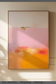 an abstract painting hanging on the wall