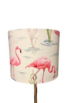 a pink flamingo print lamp shade on a white background