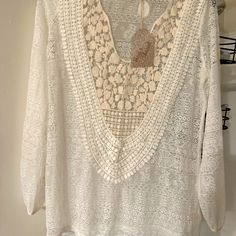 This Sheer Cream Shirt Is Beautiful. It’s A Size Small. A Tank Top Will Look Great Underneath. The Condition Is Brand New. Cream Tunic Top For Summer, Summer White Blouse With Lace Trim, Summer Blouse With Lace Trim For Brunch, White Summer Blouse With Lace Trim, Bohemian Tunic Top For Brunch, Cream Long Sleeve Lace Top For Summer, White Lace Trim Blouse For Summer, White Lace Trim Summer Blouse, Lace V-neck Top For The Beach