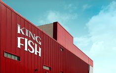 a large red building with the words king fish on it's front and side