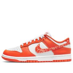 The Nike Dunk Low 'Orange Paisley' is a stylish and iconic sneaker for women. It features a white leather base with an orange upper, brand tongue, insole, and rubber sole. The Swoosh and heel are accented with a paisley bandana print, while the tongue, heel, insole, and midsole remain white. This sneaker is perfect for everyday wear, whether you're running errands or going out with friends. The inspiration for this design comes from the classic Dunk series, which has been a staple in Nike's lineup since the early 2000s. (SNKR/Skate/Low Top/Women's) 720 Nike, Nike Air Max Excee, Nike Sb Dunks Low, Cute Nikes, Nike Sb Dunks, Sb Dunk, Nike Dunk Low, Sneaker Collection, Nike Air Max 90