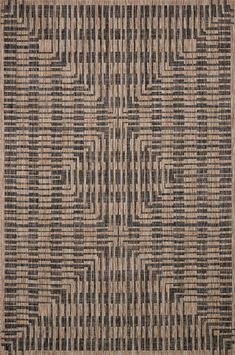 an area rug with black and tan designs on it's sides, in the shape of squares