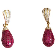 This wonderful Fabergé earring piece is a neo- vintage and has never been worn. This beautiful piece is crafted in Thailand using 18K yellow gold. The piece is adorned with numerous squared pinkish-red natural rubies and various good quality brilliant and baguette diamonds accent. It is an extremely difficult piece to make. A wonderful passionate ruby piece to add to your jewelry box. Wear with care: elegant wear only- Perfect for wear on any special occasions. 18K gold chain is included. We als Faberge Jewelry, Elegant Wear, 18k Gold Chain, Pinkish Red, Baguette Diamonds, Ruby Diamond, Yellow Gold Earring, Baguette Diamond, Ear Jewelry