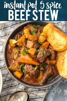 a bowl filled with stew and bread on top of a table