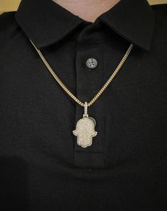 14k solid gold diamond Hamsa Pendant. Material: 14k solid Yellow Gold.Diamonds: 2.50 carats of round brilliant diamonds.Average quality used: VS2-SI1.Average diamond color used: F color.Gold weight: Approximately 9.5 grams.Length: Pendant is Approximately 1 inch long. With diamond bail 1.5 inches long. Width: 0.75 inches wide.Comes with Certificate of authentication.Comes in a nice box.Make it personal. Add a custom engraving to the back of this solid gold pendant. *Chain is sold separately. Mod Hand Set Diamond Pendant Necklaces, White Gold Cuban Link Diamond Necklace Gift, White Gold Diamond Necklace With Cuban Link, Cuban Link Jewelry With Pave Setting In Cubic Zirconia, Silver Diamond Cut Necklace Gold Plated, Cuban Link Cubic Zirconia Jewelry With Pave Setting, White Gold Cuban Link Jewelry With Pave Setting, Diamond White Cuban Link Necklace As Gift, Silver Necklace With Pave Setting In 14k Gold