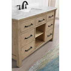 a bathroom vanity with two sinks and an area rug