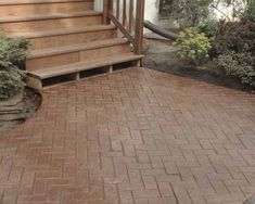 a brick patio with steps leading up to it