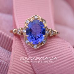 Purple Tanzanie oval halo engagement ring vintage inspired This beautiful vintage inspired engagement ring made to order features... Purple Tanzanite, Blue Sapphire Wedding Band, Gem Engagement Rings, Halo Top, Oval Halo Engagement Ring, Pink Morganite Engagement Ring, Vintage Inspired Engagement Rings, Vintage Engagement Rings Sapphire, Vintage Inspired Rings