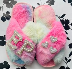 Thank you for visiting Designs By Kenia! Every time you shop small, you are supporting someone's dream and I am SO thankful that you have chosen to support mine! Faux Fur Flower Girl Slippers|Personalized Kids Slippers|Flower Girl Our slippers are hand custom made for you and it can be customized with your own text. The listing only includes 3 letters if you would like more you would have to purchase extras. The max letters you can have per slipper is 3. The material we use is faux fur which makes it so plush and fluffy, just perfect to spoil your feet The custom letters are hand made with care and love./ I do not recommend washing the slippers. The Slippers are customized with your own initials, text and therefore no returns are accepted. If you need to cancel/modify your order please con Holiday Slippers, Kids Holiday Gifts, Kids Slippers, Slippers For Girls, Custom Letters, Holidays With Kids, Christmas Gifts For Kids, Bridesmaids Gifts, Kids Gifts