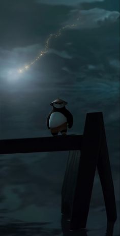 a penguin sitting on top of a wooden post in the water at night with a full moon behind it