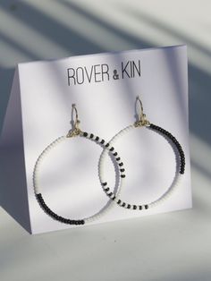 Asymmetrical and fun monochrome beaded hoops for a simple and unexpected look. Fair trade Handcrafted in India Hypoallergenic and nickel free brass + glass beads Measures 2" in length Trendy Everyday Beaded Earrings, Minimalist Small Hoop Beaded Jewelry, Minimalist Beaded Earrings With Round Beads For Everyday, Trendy Nickel-free Beaded Earrings For Everyday, Minimalist Small Hoop Beaded Earrings For Everyday, Minimalist Beaded Hoop Jewelry, Everyday Minimalist Beaded Hoop Earrings, Trendy Black Bead Jewelry For Everyday, Botanical Collection