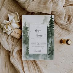 a wedding suite and ring on a blanket