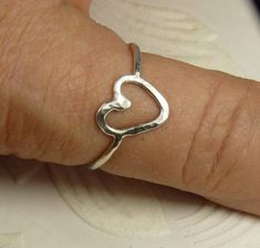 A  hammered heart  ring made with  16 gauge solid sterling silver wire. cute heart ring Can be worn by itself or stacked with other rings.Handmade sterling silver promise ring Affordable Sterling Silver Heart Cut Rings, Cheap Heart-shaped Metal Ring Jewelry, Cheap Adjustable Heart Ring, Simple Wire Rings Heart, Rings Made From Wire Heart, Cheap Silver Heart Ring For Women, Cheap Heart Charm Ring For Engagement, Cheap Adjustable Heart Cut Rings, Heart Ring Sterling Silver