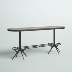 an oval table with two metal legs and a wooden top, against a white background