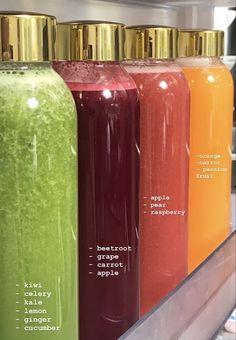 the bottles are labeled with different types of juices