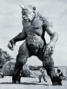 an old photo of a man dressed as a creature