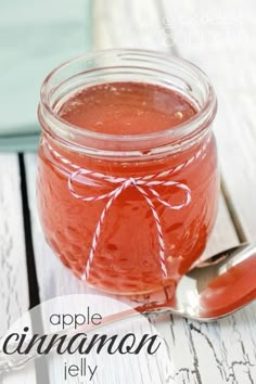 an apple cinnamon jelly in a jar with a spoon