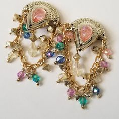 "Very pretty vintage 80s/ 90s beaded dangle chandelier earrings. The gold tone top is a sturdy plastic with a big pink tear drop bead in the center. Features cascading beads in beautiful pastel blue, green, pink and purple.  These are for non pierced ears. Measures approx. 3\" long x a little over an inch wide." Color Chandelier, Faux Fur Handbag, Drop Beads, Tear Drop, Pastel Blue, Pierced Ears, Chandelier Earrings, Clip On, Vintage Gold