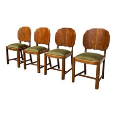 three wooden chairs with green upholstered seats